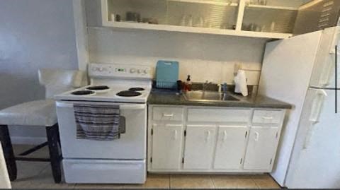 a small kitchen with a stove and a sink